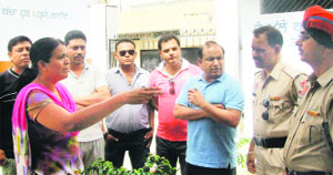 School teacher Upma talks to the police officials at the Government Boys Primary School, Bhargo Camp, in Jalandhar on Monday. 