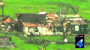Natures fury: A TV grab of the damage in the aftermath of tornadoes that touched down just outside of Wellston in Oklahoma on Sunday. 