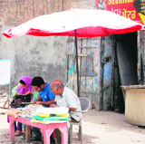 Touts operate right under the nose of the authorities outside the DTO in Amritsar.