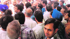 Policemen try to pacify protesting shopkeepers in Bathinda on Tuesday. a tribune photograph