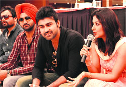 Actor Smeksha Singh, along with co-star Arya Babbar, addresses a press conference in Bathinda on Tuesday. A tribune photograph
