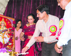 Sohan Lal Thakur, Chief Parliamentary Secretary, lights a lamp at Government Polytechnic College, Sundernagar, on Tuesday. 