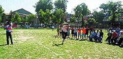 A student throws a javelin during a competition in Kangra