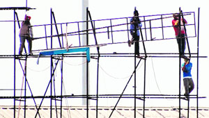 MC staff remove hoardings near Novelty Chowk in Amritsar. 