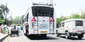 Heavy vehicles parked on a main road in Amritsar. 