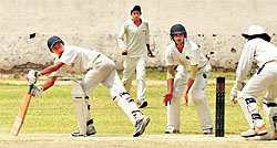 A batsman looks back as the wicketkeeper tries to stump him during a match between Chandigarh and Jalandhar at DAV Senior Secondary School in Sector 8, Chandigarh, on Wednesday