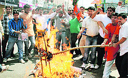 BJYM activists protest against the UPA government in Jammu on Wednesday