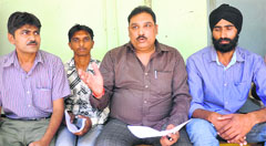 Members of the Akhil Bhartiya Safai Mazdoor Sangh address mediapersons in Jammu on Wednesday. Tribune photo: Inderjeet Singh