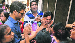 People try to console relatives of the murder victims in Ludhiana on Wednesday. 