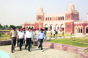 Members of a team, led by Punjab Chief Secretary Rakesh Singh, come out of the Wada Ghallughara Memorial at Rohira near Mandi Ahmedgarh on Wednesday. 