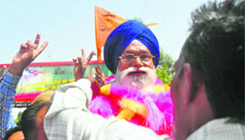 Ram Krishan, SAD canditate from Bonkar Gujjran village, celebrates his victory in the block samiti poll. 