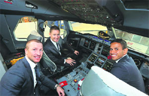 Australian vice-captain Brad Haddin, captain Michael Clarke and Usman Khawaja in the flight deck of an aeroplane at an offical Ashes farewell event in Sydney.  AFP