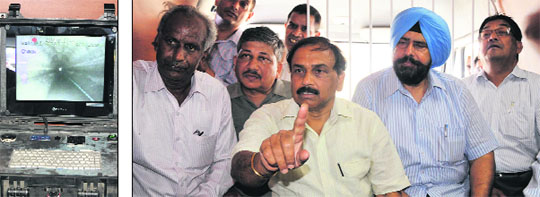 (Left) A CCTV image of the cleaned sewer; MCB officials including Mayor Baljit Singh Birbehman (in blue turban) at the meeting held to review the work of de-silting sewer lines in Bathinda on Thursday. 