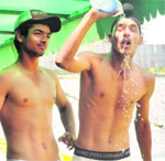 A player tries to keep himself cool during the Dhruv Pandove Cricket Tournament at the PCA Stadium in Mohali on Thursday. TRIBUNE PHOTO: VICKY GHARU 