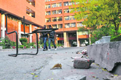 A broken chair and stones that were pelted during the protest at the PSEB office in Phase VIII, Mohali, on Thursday. Tribune photo: Vicky Gharu