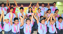Students of Gurukul Global School join hands during the launch of Girl Star Project on Thursday. Tribune Photo: Pradeep Tewari