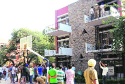 Students gather outside the boys' hostel at Panjab University in Chandigarh on Thursday. Tribune photo: Manoj Mahajan