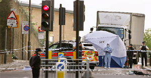 Forensics team at the crime scene where the terrorists stuck in Woolwich, south-east London.
