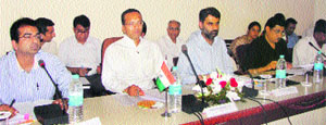 MP Naveen Jindal (second from left) addresses the audience during a meeting at the mini-secretariat in Kurukshetra recently. 