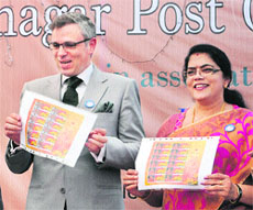 Chief Minister Omar Abdullah along with Union Minister of State for Communication and Information Technology Kruparani Killi releases a special cover during the inauguration of Srinagar Post Office Fest-2013 in Srinagar on Thursday.