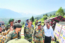 GOC of 16 Corps Lt Gen DS Hooda being briefed about the damage caused by the earthquake in Bhaderwah, on Thursday.