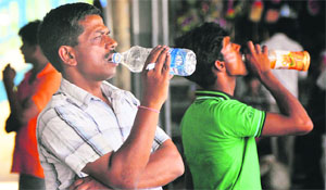 Passengers are forced to drink packaged water at the station.