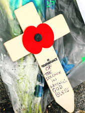A wooden cross is seen near the scene of the killing of a soldier in Woolwich on Thursday