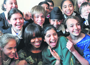 US First Lady Michelle Obama with schoolchildren after they performed part of a play at the Decatur House, a National Trust for Historic Preservation Site, in Washington on Wednesday.