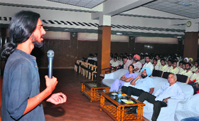 Photographer Nirvair Singh Rai interacts with the students of Baba Farid Senior Secondary School in Bathinda on Friday.