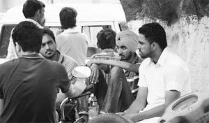 A grief-stricken brother of Amandeep (in turban) and relatives wait while his postmortem was being conducted at GMSH, Sector 16, Chandigarh, on Friday. 