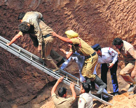 A labourer being rescued from the construction site in Sector 19, Chandigarh, on Friday. 