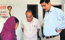 Deputy Commissioner Saket Kumar counsels a girl to take iron tablets in a government school at Bhunderwas in Ratia block of Fatehabad