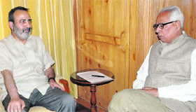 Chief Secretary Mohammad Iqbal Khandey with Governor NN Vohra in Raj Bhawan in Srinagar on Friday.