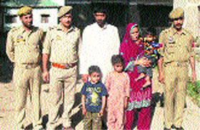 The arrested Hizb militant with his Pakistani wife and children.