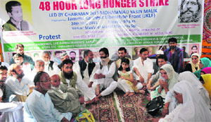 JKLF chief Yasin Mailk along with his supporters on fast in Srinagar on Friday. 