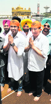 Actor and Congress MP Raj Babbar with his son Arya at the Golden Temple on Friday.