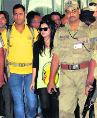 Chennai Super Kings captain M.S. Dhoni and wife Sakshi arrive in Kolkata on Friday.