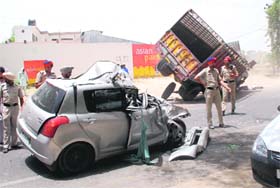 Mangled remains of a Swift car and a truck involved in an accident near NFL light point on the Goniana road in Bathinda on Saturday