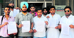 SFI and INSO members show the memorandum regarding the safety of students on the campus during a press conference at the Student Centre, Panjab University, on Saturday