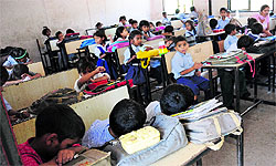Children doze off due to heat in a classroom at Government Primary School, Hallo Majra