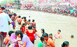 Devotees take a dip in the Ganga at Brahma Kund, Har-ki-Pauri, on the occasion of Buddha Purnima in Haridwar on Saturday
