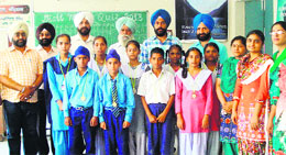 Students of Government Senior Secondary School, Mattewal, along with the staff of the school after winning the district-level maths quiz in Amritsar on Sunday. 
