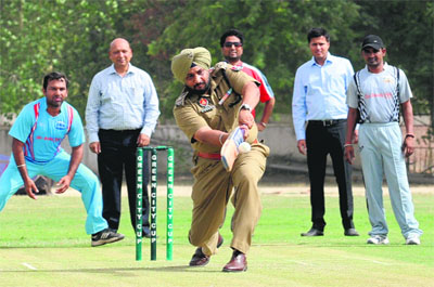 SSP Ravcharan Singh Brar plays a shot to inaugurate the 1st Drug De-Addiction Bathinda Cricket League at the Police DAV Public School cricket ground on Sunday.