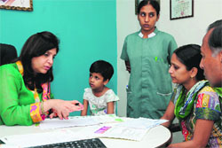 Paediatric gastroenterologist Dr Neelam Mohan (left) from the Medanta  The Medicity, Gurgaon, examines children at a medical camp in Bathinda on Sunday. 
