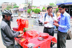 Cool comfort: Two youths savour watermelon to beat the searing heat on the Power House Road in Bathinda. 