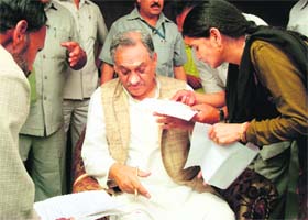 Chief Minister Vijay Bahuguna listens to the problems of people during the janta darbar held at Badkot tehsil in Uttarkashi district on Sunday