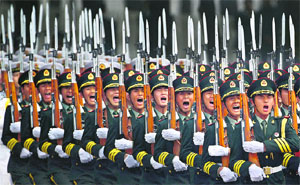 Chinese troops on parade in Beijing. The collusive support between Pakistan and China to keep the Indian armed forces engaged poses serious strategic concerns for India.