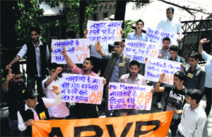 ABVP activists protest against the Naxal attack in Chhattisgarh, at the DC office in Shimla on Sunday