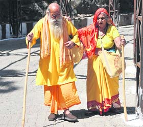 An elderly couple on way to the cave shrine