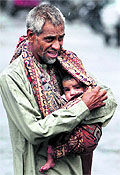 A man carries a child